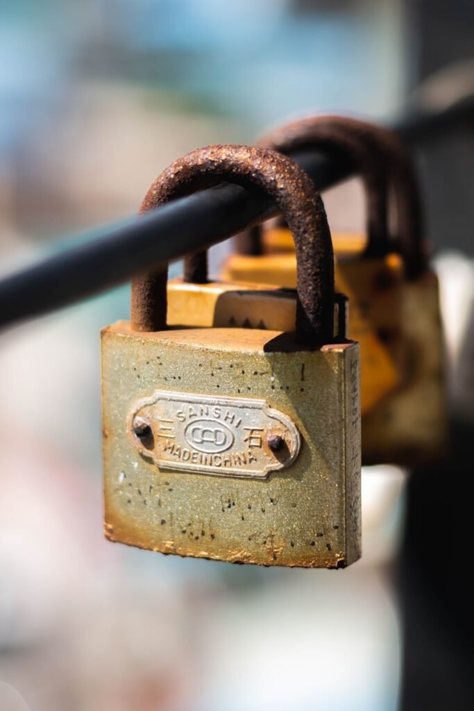 a padlock attached to a metal pole