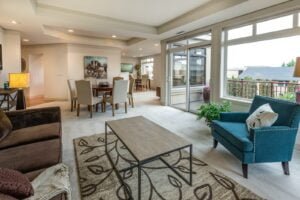 brown wooden coffee table and blue armchair